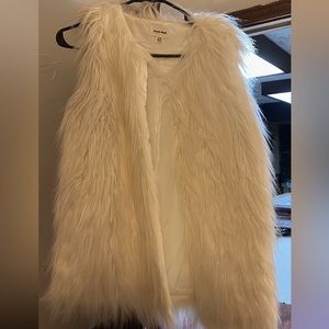 White fur vest